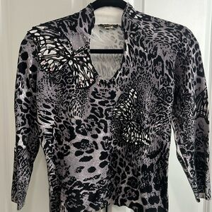 Gray and black animal print sweater with butterfly pattern